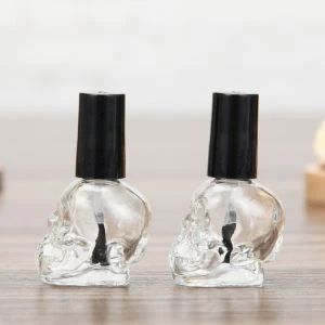 Botella de esmalte de uñas de vidrio con forma de calavera